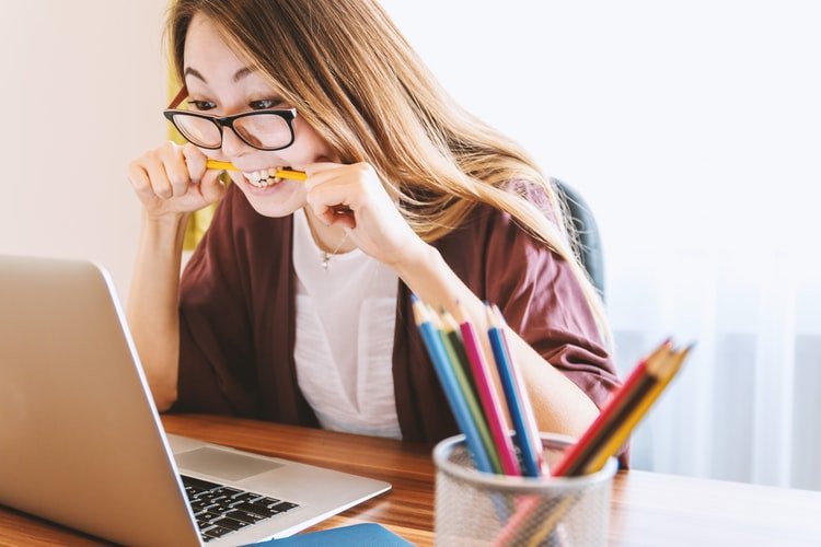 A girl looking at a laptop